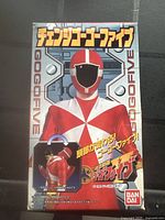 Front of sealed box with Red Ranger on front and Japanese text.