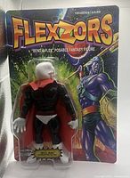 Front view of the Skull Man figure sealed in card packaging, showing colorful cosmic fantasy artwork and character.