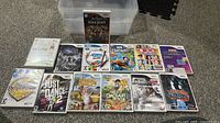 Group photo of all 13 Nintendo Wii games with their cases and manuals.