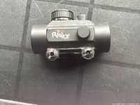 Side view of Tasco Pro Point MOA Red Dot Scope showing branding and mounting hardware.