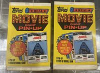 Two unopened yellow 1981 Topps Movie Giant Pin-Up wax packs, each showing the Jaws movie poster design