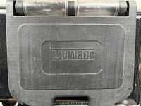 Closed black molded plastic case labeled Dewalt, showing exterior condition