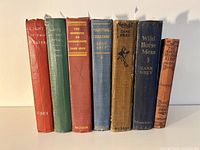 Front view of seven Zane Grey Western novels showing varied cloth hardcover bindings and titles.