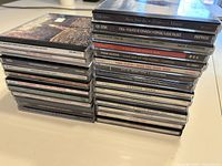 Photo showing spines of stacked CDs including Neil Young & Crazy Horse, Steely Dan, Pink Floyd, and Genesis albums.