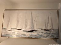 Full view of framed canvas painting showing sailboats in textured impasto style with thin light wood frame