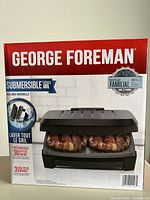 Front view of George Foreman Submersible Series Grill box showing family size 388 cm² cooking area and dishwasher-safe features