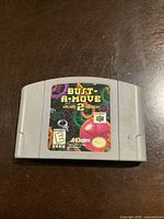 Gray Nintendo 64 cartridge with original game label for Bust-A-Move 2 Arcade Edition.