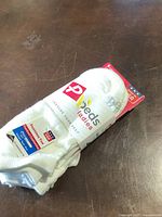 White packaged ladies sports socks with Peeds branding and product features visible.