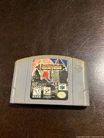 Front view of gray Nintendo 64 cartridge showing Castlevania game label with castle artwork and logos.