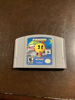Front of Nintendo 64 MS Pac-Man cartridge showing label artwork and ESRB rating.