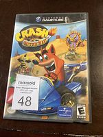 Front cover of Nintendo GameCube Crash Nitro Kart game case with cover art featuring Crash Bandicoot in a kart and identification sticker.