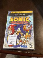 Front cover of the Nintendo GameCube Sonic Mega Collection game case showing Player's Choice label, Sonic characters, and game title.