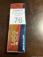 Front and top view of sealed Dunlop Loco Motion golf balls box showing branding and item quantity.