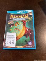 Front cover of the Wii U game Rayman Legends in original blue plastic case, with Ubisoft logo visible.