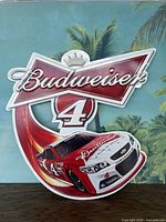 Full front view of the Budweiser NASCAR Kevin Harvick metal wall sign showing branding, number 4, and race car image.