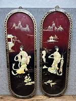 Both black lacquer mother of pearl wall plaques side by side showing full detail and size