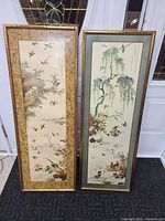 Front view of both framed Asian prints side by side