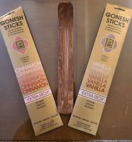 Front view of both Gonesh incense boxes and wooden holder