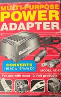 Front of box showing Koolatron multi-purpose power adapter image and specs