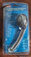 Front of packaged Classic hand held massage shower head