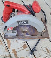 Top view showing Skil circular saw with 7.25-inch blade and rusted baseplate