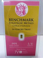 Front of plastic card showing Benchmark Strategic Metals brand, Statue of Liberty image, .999 Fine Gold 1/4 Grain text, and certification details.