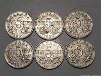 Six Canadian five-cent coins dated 1930, reverse side showing denomination and maple leaves