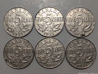 Six 1934 Canadian five cent coins reverse side showing large 5 and maple leaves with 'CANADA' and 'FIVE CENTS' date 1934