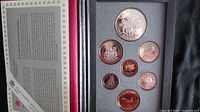 Full set of Canadian coins set in protective foam insert inside a display case.