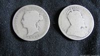 Obverse sides of two Canadian quarters showing Queen Victoria and Edward VII.