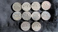 Reverse side of ten Canadian 5-cent coins from 1950s, showing beaver design and date inscriptions.