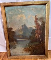 Frontal photo showing the full antique oil on canvas painting in wooden frame with natural landscape scene.