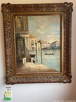 Full view of framed oil painting depicting a Venice canal scene in ornate gilt frame