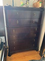 Full front view showing overall shape, mahogany finish and hardware