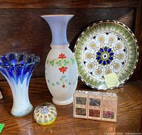 Full lot view showing Royal Doulton Cyprus platter, two art glass vases, decorative glass paperweight, and boxed gemstone set.