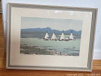 Full view of framed serigraph print showing teepees and mountains under soft light