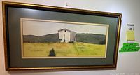 Framed watercolor painting depicting a rural landscape with a white building, signed 'Shute'.