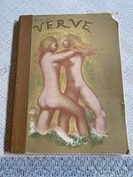 Front cover showing gilt illustration of two nude women embracing on matte gold background, cloth spine
