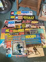 Photo showing an array of vintage hockey magazines from 1970 and 1971 with colorful covers portraying hockey players and various headlines.