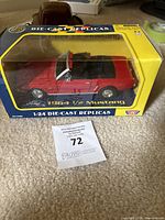 Front and side view of the 1:24 red 1964 1/2 Ford Mustang die-cast replica inside original Motor Max packaging