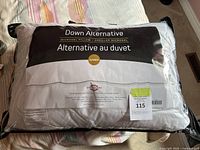 Photo of packaged Down Alternative Microgel Pillow showing product label and packaging.