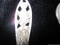 Close-up of pierced foliage handle detailing