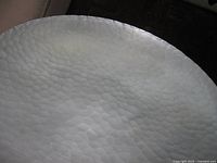 Close view showing hammered aluminium texture of bowl interior