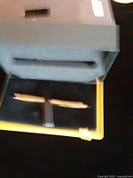 Open presentation box showing gold-filled pen