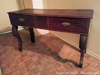 Full view of antique hall table showing drawers, legs, top surface