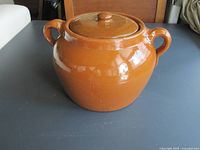 Bean pot with lid on, showing overall shape and handles