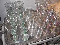 Top view of rectangular silver plate tray holding glassware