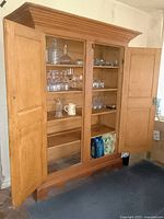 Interior view with doors open displaying four shelves