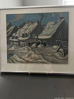 Frontal view of the framed painting showing snowy cabin scene