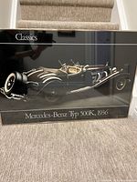 Framed photo print showing a 1936 Mercedes-Benz Typ 500K classic car, framed under glass with a metallic bronze frame, measuring approximately 36x24 inches.